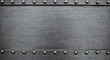 © Concept Studio - Heavy industrial metal background plate with rows of steel rivets along the top and bottom borders. Dark, weathered, and scratched metallic surface texture