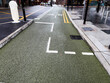Urban bike lane in Manchester UK with marked pathway and city setting