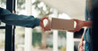 © FlexiTon25/peopleimages.com - Box, delivery and hands of people in home for direct to door courier service or shipping. Ecommerce, giving or package with customer and postal worker at entrance to apartment to complete order