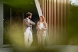 © Zoran Jesic - Business people talking outside office building during coffee break