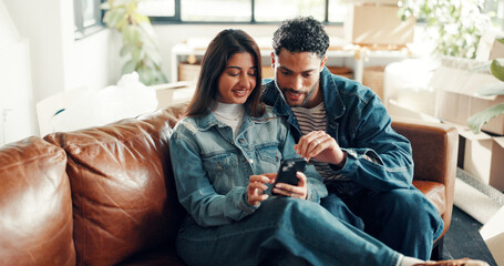 Happy couple, reading and together on couch with phone, bonding and scrolling online for social media post. Smile, man and woman in home with mobile, connection and notifications on digital app.