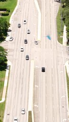 Wall Mural - Vertical Drone Shot, Tracking Cars on American Avenue, Florida USA