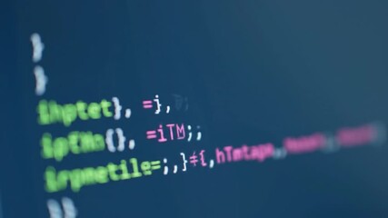 Computer Code Snippets Running Green and Pink on a Dark Blue Screen