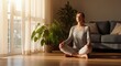 © andreiko - Woman practicing yoga and meditation on a mat in her sunlit modern living room. Peaceful morning routine: A woman finds inner balance with meditation at home.