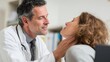 © Vladimir - Doctor examining a female patient’s neck during medical consultation.