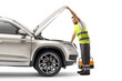 © Ljupco Smokovski - Road assistance worker checking a vehicle with an open hood