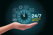© MiraCle72 - Hand holding clock and customer service icons representing round-the-clock support and rapid response to inquiries