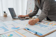 © Kritdanai - Businesswoman Analyzing Financial Data Charts