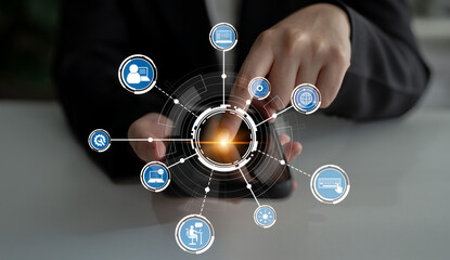 A professional engages with a smartphone, surrounded by digital icons representing various aspects of technology and communication, highlighting modern business strategies and solutions. Crux