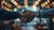© alle - Handshake Between Two People in Modern Indoor Setting with Warm Lighting