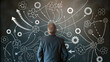 © Chiam - Man facing tangled lines of complex problem concept. A businessman analyzing complex strategies on a chalkboard.