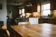 © Molang Visual - Cozy wooden dining table in a warm kitchen interior