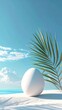 © kasyaa - White egg on beach, palm frond, bright sky