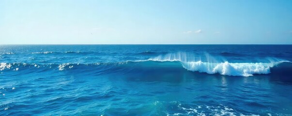 Wall Mural - Vast expanse of deep blue ocean water, waves gently rolling under a clear sky  Perfect for travel, nature, and serenity themes ,  tranquil,  boundless