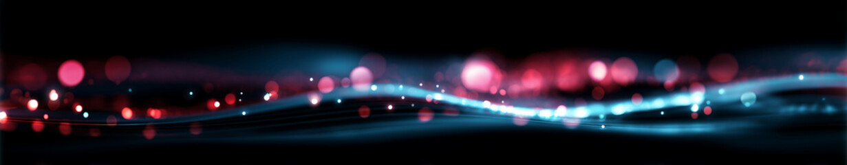 Close-up abstract pattern of glowing blue and red dots and waves on black surface, with blurred lights and bokeh effect in foreground