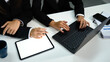 © Prathankarnpap - Team collaboration concept with executives using modern technology at workplace