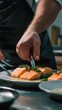 © Shyamal - Chef garnishing salmon fillets with fresh dill on a plate fish seafood photo