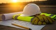 © Satriyo - Construction Site Essentials A Close-Up of Blueprint, Helmet, and Gear at Sunset