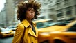 © KarpenArt Studio - a stylish woman with voluminous afro hair looks thoughtfully off-camera amidst the blurred motion of new york city taxis.