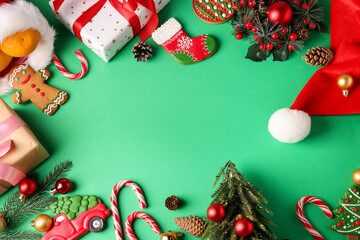 Wall Mural - Saint Nicholas day. Different treats, festive decor and gift boxes on green background, flat lay. Space for text