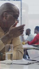 Wall Mural - animation of data processing over diverse business people at office