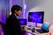 © Wanchai - Happy investor raising fist while watching bullish charts.