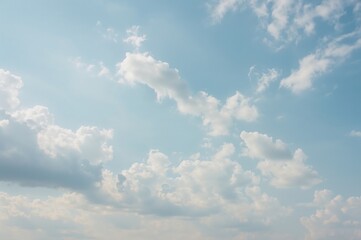 wide-angle shot capturing a bright, windy sky with blue hues, resembling a cloudy day in spring or s