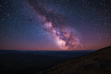 Wall Mural - Galaxy and rosy glow over mountain peaks at night. Vibrant star-filled sky with rolling hills. Stunning cosmic scenery. Celestial backdrop featuring stars and nebulae. Adventure theme.