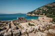 Ancient megalithic city ruins devastated by an earthquake near the sea, surrounded by nature in summer vacation