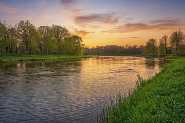 Wall Mural - sunrise over the flowing river in spring