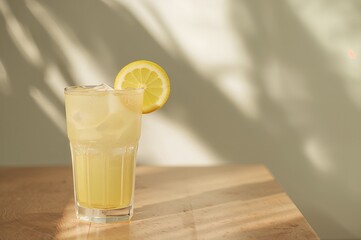 Wall Mural - Close-up of lemonade with sunlight and shadows, summer refreshment theme with empty space