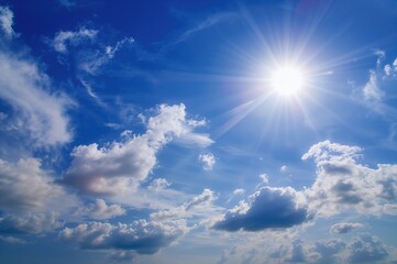 Wall Mural - Clear blue sky with radiant clouds at the edge of a tropical border