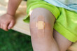 © KseniaJoyg - Little child with Band-Aid on her knee
