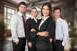 © BillionPhotos.com - Successful Businesswoman Standing with Business Team In Modern Office