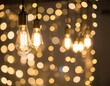 © Sadi - Warm Edison bulbs, glowing softly, with bokeh lights