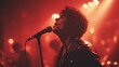 © dex - Emotional male vocalist singing into a microphone at a live music concert