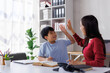 © Phimwilai - Asian mother and son giving high five while homeschooling