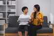 © Phimwilai - Asian mother congratulating son for good school results at home