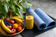 © Azmanrazak - Healthy Eating and Dieting: Fresh Fruits, Smoothie, and Yoga Mats for a Balanced Lifestyle Focused on Wellness and Nourishment
