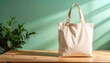 © Talitha - Beige Tote Bag on Wooden Table with Green Background