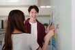 © Natee Meepian - Creative Team Discussing UX UI Design Concepts