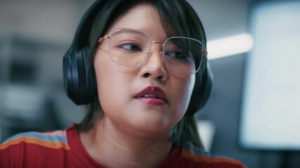 Focused Asian Female IT Professional, Software Engineer Focused on Typing Code, Developing software application, Artificial Intelligence machine learning data development and cybersecurity innovation.