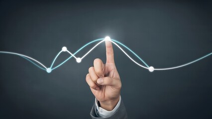 Wall Mural - A hand traces the lines of the business graph, representing growth and achievement, perfect for illustrating business concepts and financial analysis.