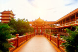 Serene asian temple architecture with red roofs at sunrise