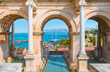 View of Hadrian's Gate in old city of Antalya with Antalya old town or harbour (Kaleici), Bay with ships and boats in summer - Antalya, Turkey 