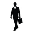 © MDSAEEM - A businessman walking forward with a briefcase a striking silhouette