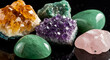 © FLOWZON - Assortment of polished and raw gemstones including amethyst and citrine