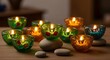 © Shraddha - Vibrant oil lamps glow on a rustic wooden surface with decorative stones, creating a warm, festive atmosphere.