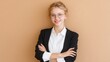 © J. Grayscale - Confident Young Businesswoman Smiling Against a Warm Background