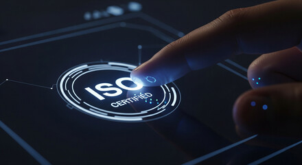 Finger touching a futuristic screen displaying ISO certification symbol, representing quality and standards.